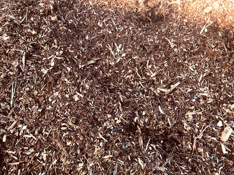 large pile of wood chipings